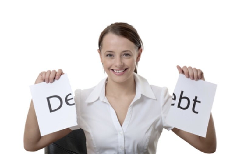 Woman tearing up debt sign